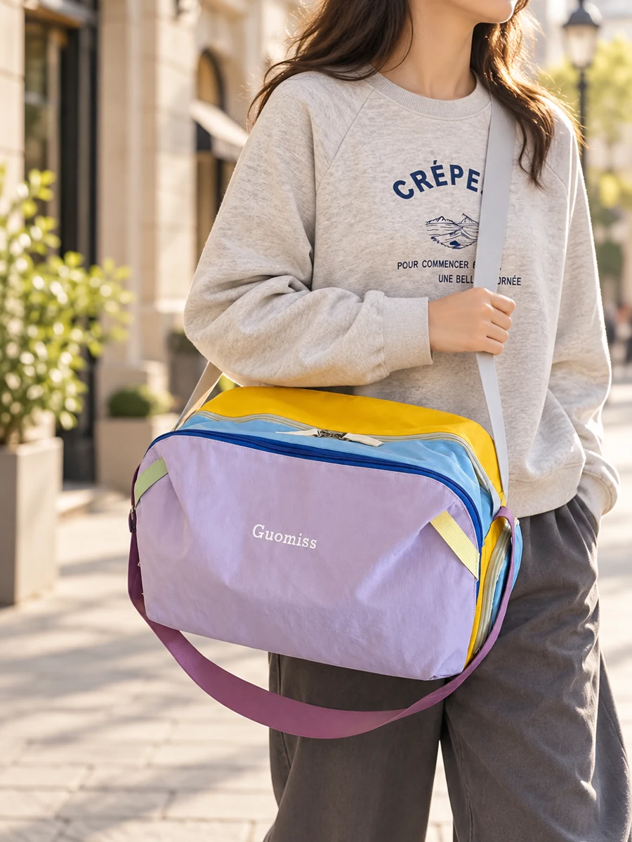 Purple crossbody bag on a city street